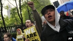 Occupy Wall Street protesters march to the Bank of America headquarters in New York, May 1, 2012. 