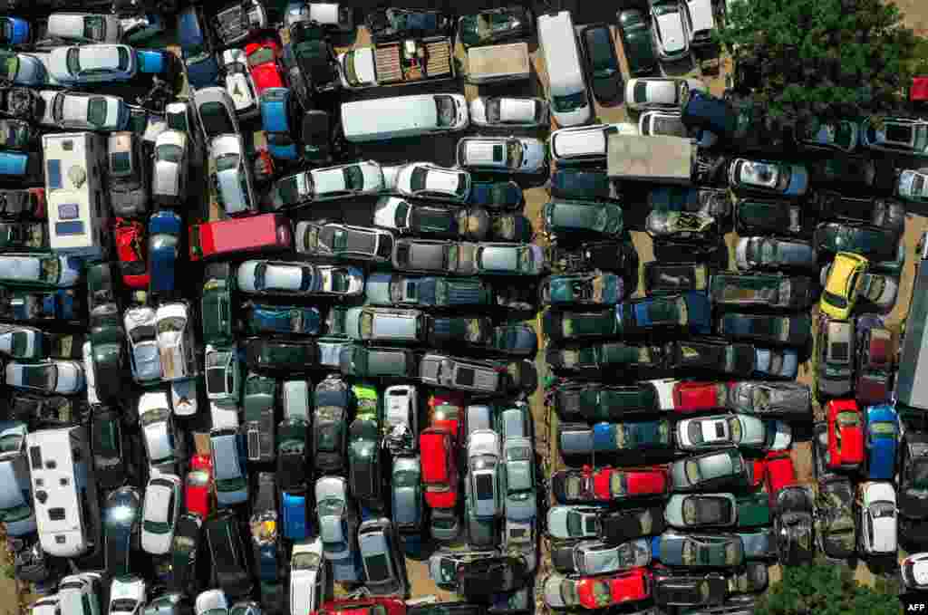 An aerial view shows cars damaged by the floods at a collection point in Bad Neuenahr, western Germany, weeks after heavy rain and floods caused major damage in the Ahr region.