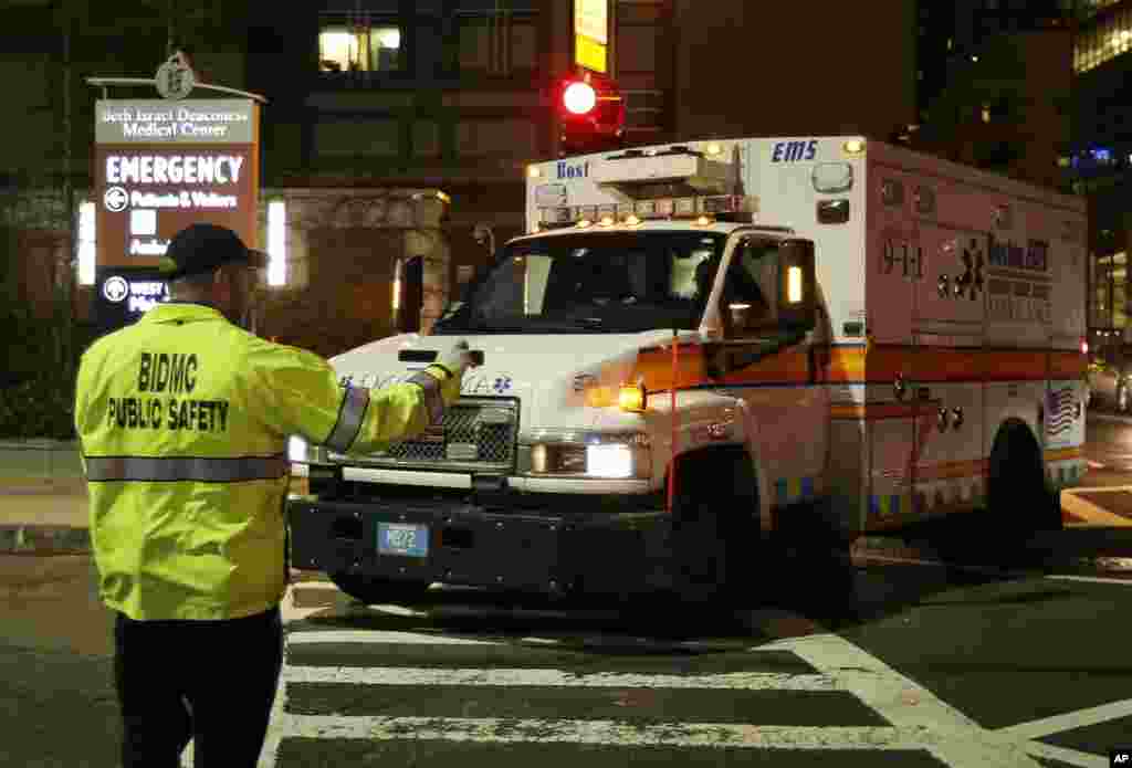 An ambulance carrying Dzhokhar Tsarnaev, a19-year-old Massachusetts college student wanted in the Boston Marathon bombings, turns into Beth Israel Deaconess Medical Center after he was captured in an all day manhunt, April 19, 2013.