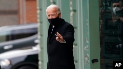 President-elect Joe Biden leaves after announcing his choice of retired Army Gen. Lloyd Austin to be secretary of defense, at The Queen theater in Wilmington, Del., Dec. 9, 2020. 