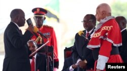 John Magufuli, left, was sworn in as Tanzania's president in Dar es Salaam, November 5, 2015. REUTERS/Emmanuel Herman