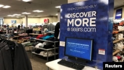 FILE - An online shopping kiosk is shown inside a Sears department store in La Jolla, California, March 22, 2017. 