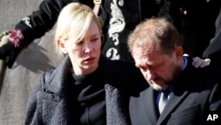 Actress Cate Blanchett and her husband Andrew Upton leave the funeral of actor Philip Seymour Hoffman, Feb. 7, 2014, in New York.