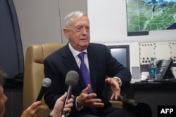 U.S. Defense Secretary Jim Mattis aboard his official aircraft on the first leg of a trip which will take him to China, South Korea and Japan, June 24, 2018
