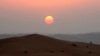 FILE - The sun sets in the Rub' al-Khali desert, which encompasses most of the southern third of the Arabian Peninsula. One reason that such regions are so dry is that they lack vertical movement of moist air.