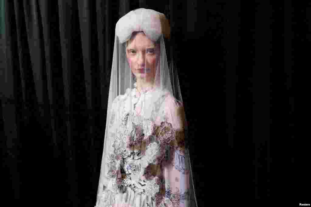 A model poses backstage during preparations for the Bora Aksu show at London Fashion Week in London, Britain.