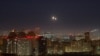 FILE - Explosions are seen in the sky over the city during a Russian drone strike, amid Russia's attack on Ukraine, in Kyiv, Ukraine November 25, 2024. 