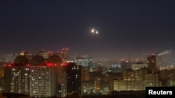 FILE - Explosions are seen in the sky over the city during a Russian drone strike, amid Russia's attack on Ukraine, in Kyiv, Ukraine November 25, 2024. 