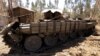 A tank destroyed recently during fighting between the Ethiopian National Defense Force (ENDF) and the Tigray People's Liberation Front (TPLF) forces is seen on the roadside in Gashena of Amhara region, Ethiopia Dec. 7, 2021.