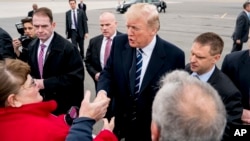 President Donald Trump greets guests on the tarmac as he arrives at Greenbrier Vally Airport, in Lewisburg, W.Va., Feb. 1, 2018, to speak at the 2018 House and Senate Republican Member Conference at The Greenbrier.