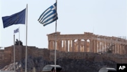 Greece reached an agreement with Europe on its debt. But debt campaigners say many developing countries are falling into a debt trap. (AP Photo/Thanassis Stavrakis)