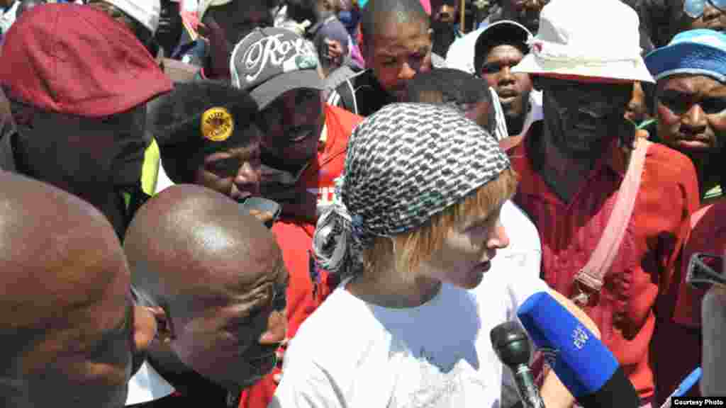 Striking workers surround Liv Shange, a leader of South Africa's Workers and Socialist Party at a protest near Johannesburg. (Courtesy WASP)