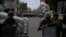 FILE - Marines block the area where a suspected drug gang leader and seven others were killed, according to the Navy, in the Tlahuac neighborhood of Mexico City, July 20, 2017. 