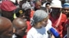 Striking workers surround Liv Shange, a leader of South Africa's Workers and Socialist Party at a protest near Johannesburg. (Courtesy WASP)