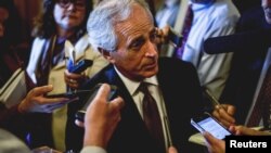 FILE: Senator Bob Corker speaks to reporters at the US Capitol in Washington, April 21, 2015. 