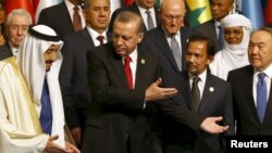 Turkish President Tayyip Erdogan (2nd L) is seen with King Salman of Saudi Arabia (L), Sultan of Brunei Hassanal Bolkiah (2nd R), and Kazakhstan's President Nursultan Nazarbayev (R) at a family photo session during the Organisation of Islamic Cooperation 