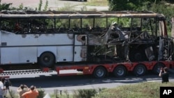 Bus destroyed in a deadly suicide attack on Israeli vacationers is transported out of Burgas airport, Bulgaria, July 19, 2012.