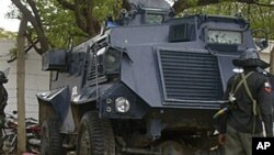 Bodies lay on the streets near an armored vehicle in Maiduguri after religious clashes in Northern Nigeria, July 31, 2009 (file photo).