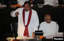 Sri Lanka's newly appointed Prime Minister Mahinda Rajapaksa speaks during the parliament session in Colombo, Sri Lanka, Nov. 15, 2018.