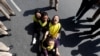 FILE - Tibetans shout slogans during a protest to mark the 61st anniversary of the Tibetan uprising against Chinese rule, outside the Chinese Embassy in New Delhi, India, March 10, 2020.