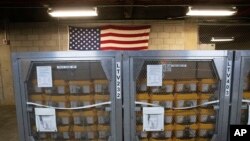 FILE - Cages of ventilators, part of a shipment of 400, arrive at the New York City Emergency Management Warehouse, March 24, 2020. 