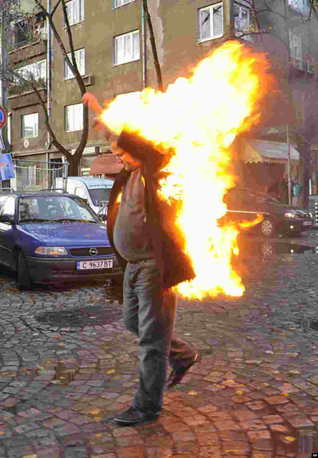 Bulgarian Rosen Markov sets himself on fire in front of the Bulgarian National Television building, to protest against the broadcast of news bulletins in the Turkish language, in central Sofia, November 10, 2009. (Reuters)