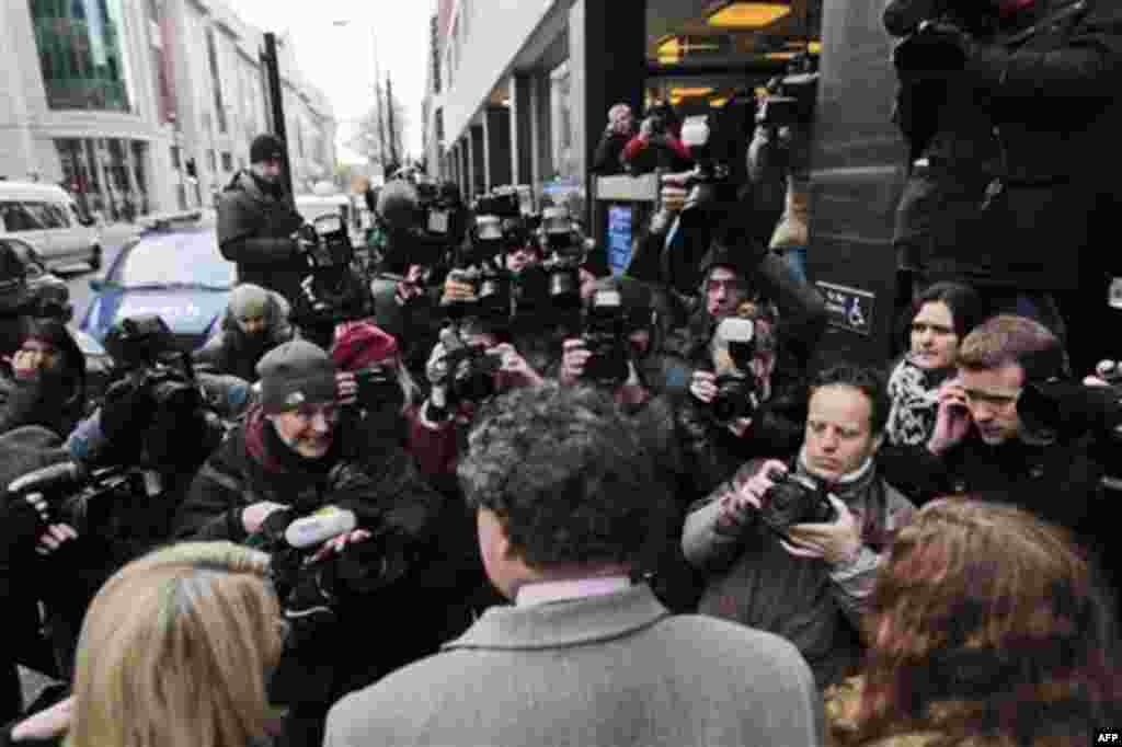 Mark Stephens, center back to camera, lawyer for whistle-blowing website WikiLeaks founder Julian Assange, speaks to the media as he arrives at City of Westminster Magistrates Court in London, Tuesday, Dec. 7, 2010. Julian Assange is appearing at the cour