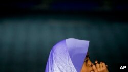 FILE - A Rohingya Muslim child sits at a school in Klang, outside of Kuala Lumpur, Malaysia, Sept. 12, 2017.