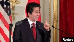 FILE - Japan's Prime Minister Shinzo Abe speaks during a joint news conference with US President Donald Trump (not seen), at Akasaka Palace in Tokyo, Japan, May 27, 2019. 
