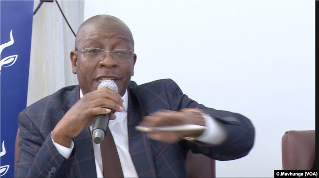 Ziyambi Ziyambi, Zimbabwe’s justice minister, speaks at a public meeting in Chinhoyi town, May 10, 2019.