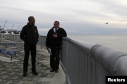 U.S. President Barack Obama (L) tours the Kotzebue Shore Avenue Project, an effort to protect against rising sea levels in Kotzebue, Alaska Sept. 2, 2015.