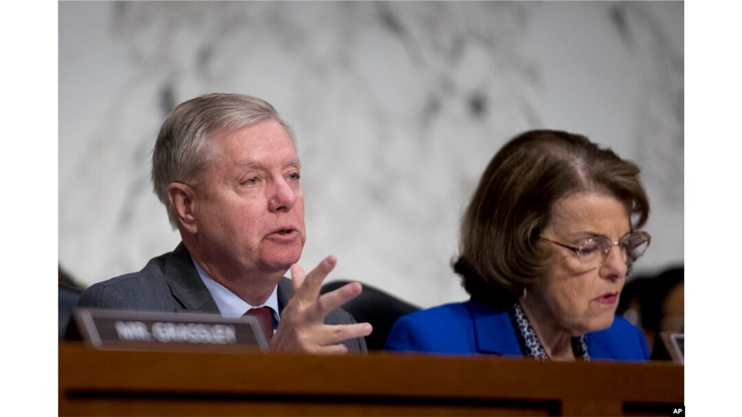 Senate Judiciary Committee Chairman Lindsey Graham, R-S.C., accompanied by Ranking Member Sen. Dianne Feinstein, D-Calif.,(R) questions Attorney General nominee William Barr during a Senate Judiciary Committee hearing on Capitol Hill in Washington, Jan. 15, 2019.