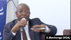 Ziyambi Ziyambi, Zimbabwe’s justice minister, speaks at a public meeting in Chinhoyi town, May 10, 2019.