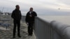 U.S. President Barack Obama (L) tours the Kotzebue Shore Avenue Project, an effort to protect against rising sea levels in Kotzebue, Alaska Sept. 2, 2015. 