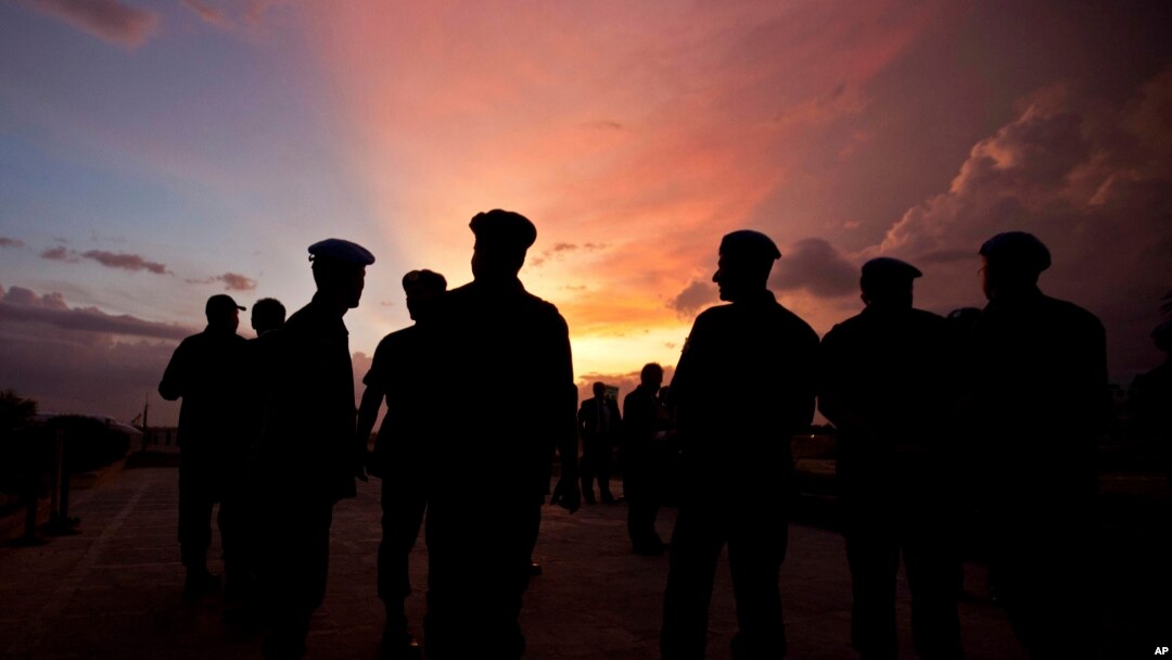 FILE - This photo shows silhouettes of U.N. peacekeepers from Brazil at the airport in Port-au-Prince, Haiti, July 11, 2011. 