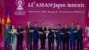 Japan Prime Minister Shinzo Abe, fifth left, poses for a group photo with leader of ASEAN from left; Malaysia Foreign Minister Saifuddin Abdullah, Myanmar leader Aung San Suu Kyi, Philippines President Rodrigo Duterte, Singapore Prime Minister Lee Hsien L