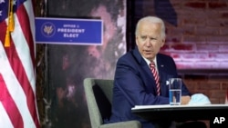 President-elect Joe Biden attends a briefing on the economy at The Queen theater in Wilmington, Delaware, Nov. 16, 2020.
