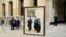 FILE - Graduates are seen queueing to have their photograph taken after a graduation ceremony at Oxford University in southern England.