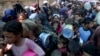 Palestinians line up for food distribution in Deir al-Balah, Gaza Strip, on Oct. 17, 2024.