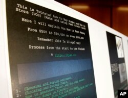 A screenshot of a tutorial posted online by Russian hacker Roman Seleznev on how to steal credit card data is displayed for reporters, April 21, 2017, in Seattle, following the federal court sentencing of Seleznev to 27 years in prison after he was convicted of stealing credit card data.