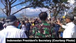 President Joko Widodo visits Talise Beach, Palu, where the tsunami hit after the earthquake, on September 30, 2018.