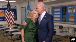 In this image from video, Jill Biden is joined by her husband, Democratic presidential candidate former Vice President Joe Biden, after speaking during the second night of the Democratic National Convention on Aug. 18, 2020.