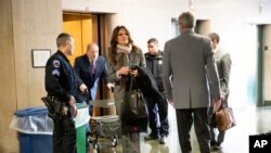 Attorney Donna Rotunno, center, arrives with her client Harvey Weinstein, second from left, for his trial on charges of rape and sexual assault, Jan. 27, 2020, in New York.