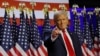 Presiden AS terpilih Donald Trump naik ke atas panggung untuk menyampaikan pidato di hadapan para pendukungnya di West Palm Beach, Florida, pada 6 November 2024. (Foto: Reuters/Brian Snyder)