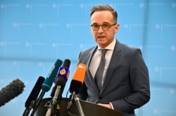 German Foreign Minister Heiko Maas addresses the media at the Foreign Ministry in Berlin on March 17, 2020, to comment on the situation concerning the spread of the novel coronavirus. (Photo by Tobias Schwarz / AFP)