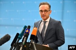 German Foreign Minister Heiko Maas addresses the media at the Foreign Ministry in Berlin on March 17, 2020, to comment on the situation concerning the spread of the novel coronavirus. (Photo by Tobias Schwarz / AFP)
