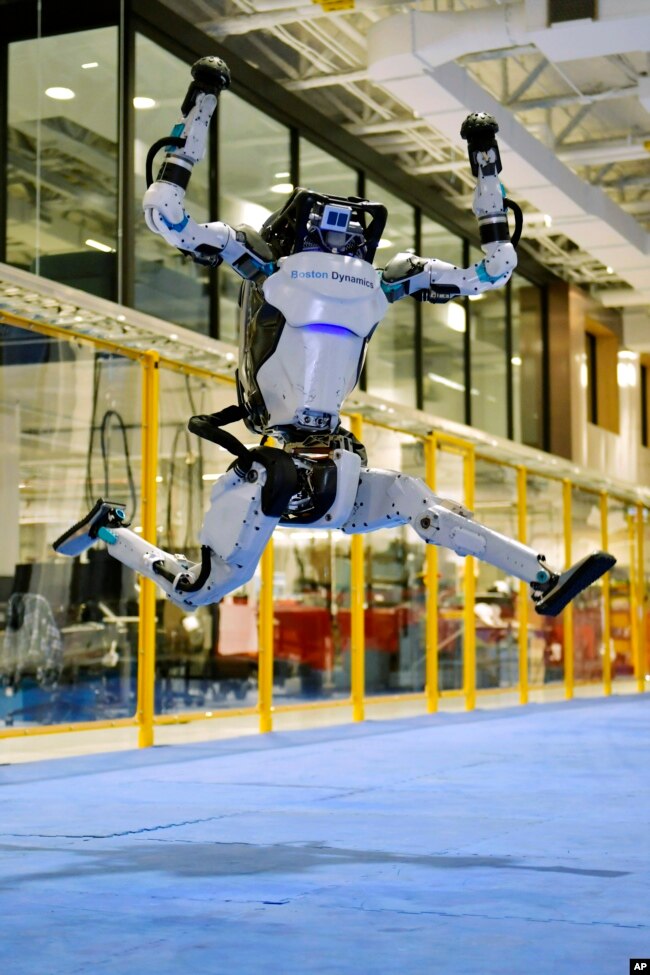 A Boston Dynamics Atlas robot performs a jump during a demonstration, Wednesday, Jan. 13, 2021, at the company's facilities in Waltham, Mass. (AP Photo/Josh Reynolds)