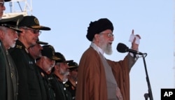 In this picture released by official website of the office of the Iranian supreme leader, May 10, 2017, Ayatollah Ali Khamenei speaks during a graduation ceremony of a group of the Revolutionary Guard cadets in Tehran, Iran. Khamenei warned Wednesday that anyone trying to foment unrest around the upcoming presidential election "will be given a slap."