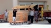 Customers buy plywood sheets to protect their homes at a Home Depot in Florida City, Fla., Sept. 8, 2017. Hurricane Irma weakened slightly Friday but remained a dangerous and deadly hurricane taking direct aim at Florida.