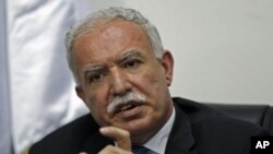 Palestinian Foreign Minister Riad Al-Maliki gestures as he speaks during a news conference in the West Bank city of Ramallah, September 15, 2011.